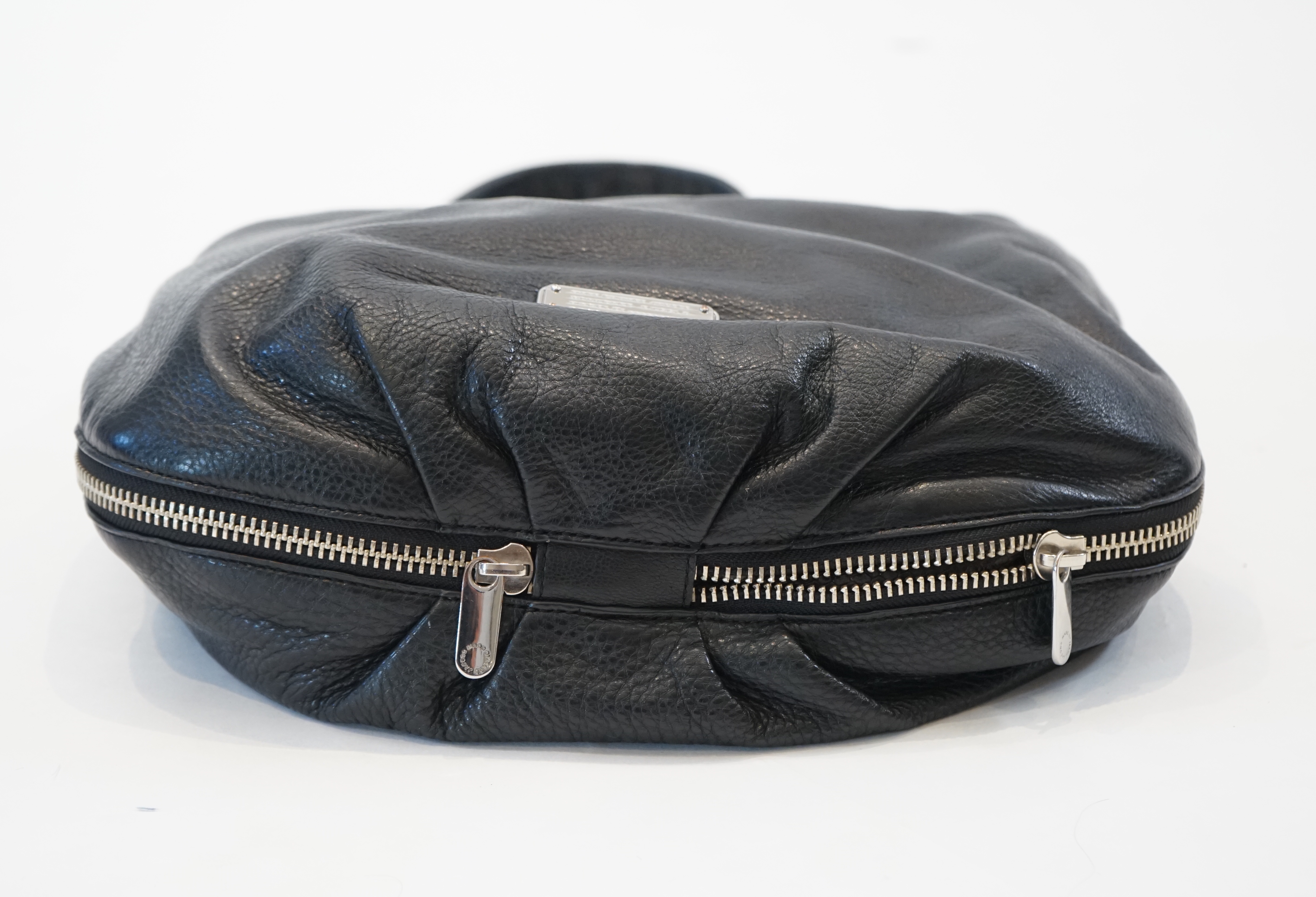 A Marc Jacobs black leather boho with silver zip detail, width 40cm, depth 15cm, height 35cm